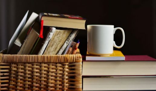 ways to empower yourself reading book pile of books with a cup of tea