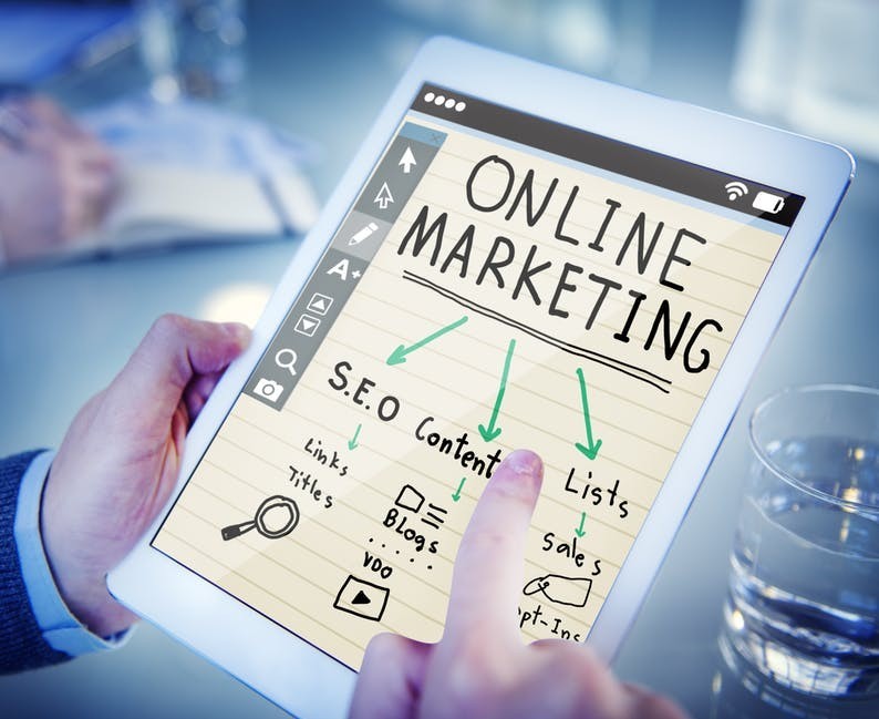 tablet with online marketing success tips on its screen