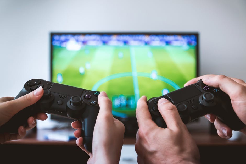 two people playing xbox in front of the tv art of subtle marketing