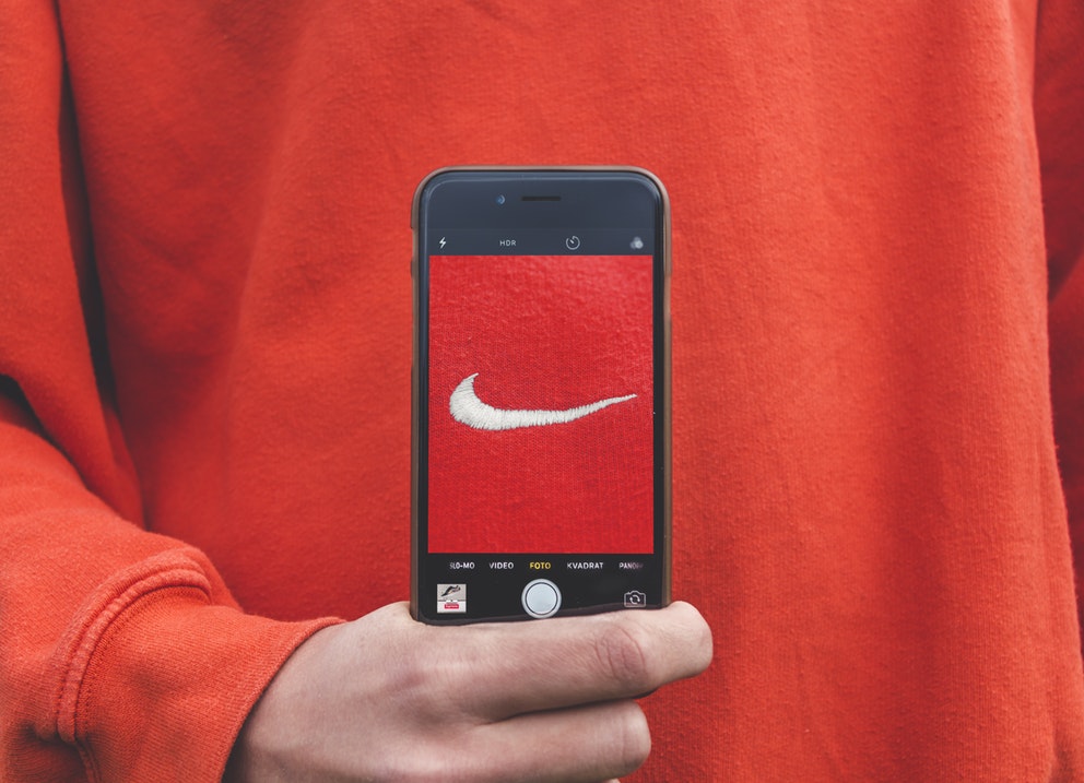 nike logo on red teeshirt showing through iphone