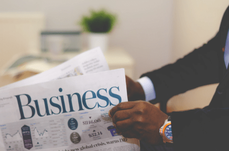 hand turning a business paper