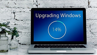 computer-screen-with-upgrading-windows-note-on-screen-at-14-percent