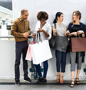 people with shopping bags waiting