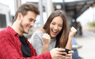 newsontop17 review couple smiling with an iphone