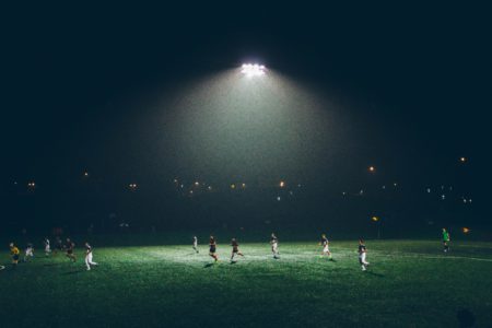 football players on a field at night