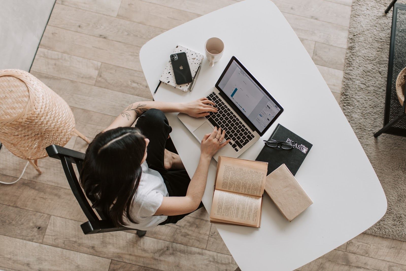 young-lady-typing-on-keyboard-of-laptop-in-living-room strategies for achieving success