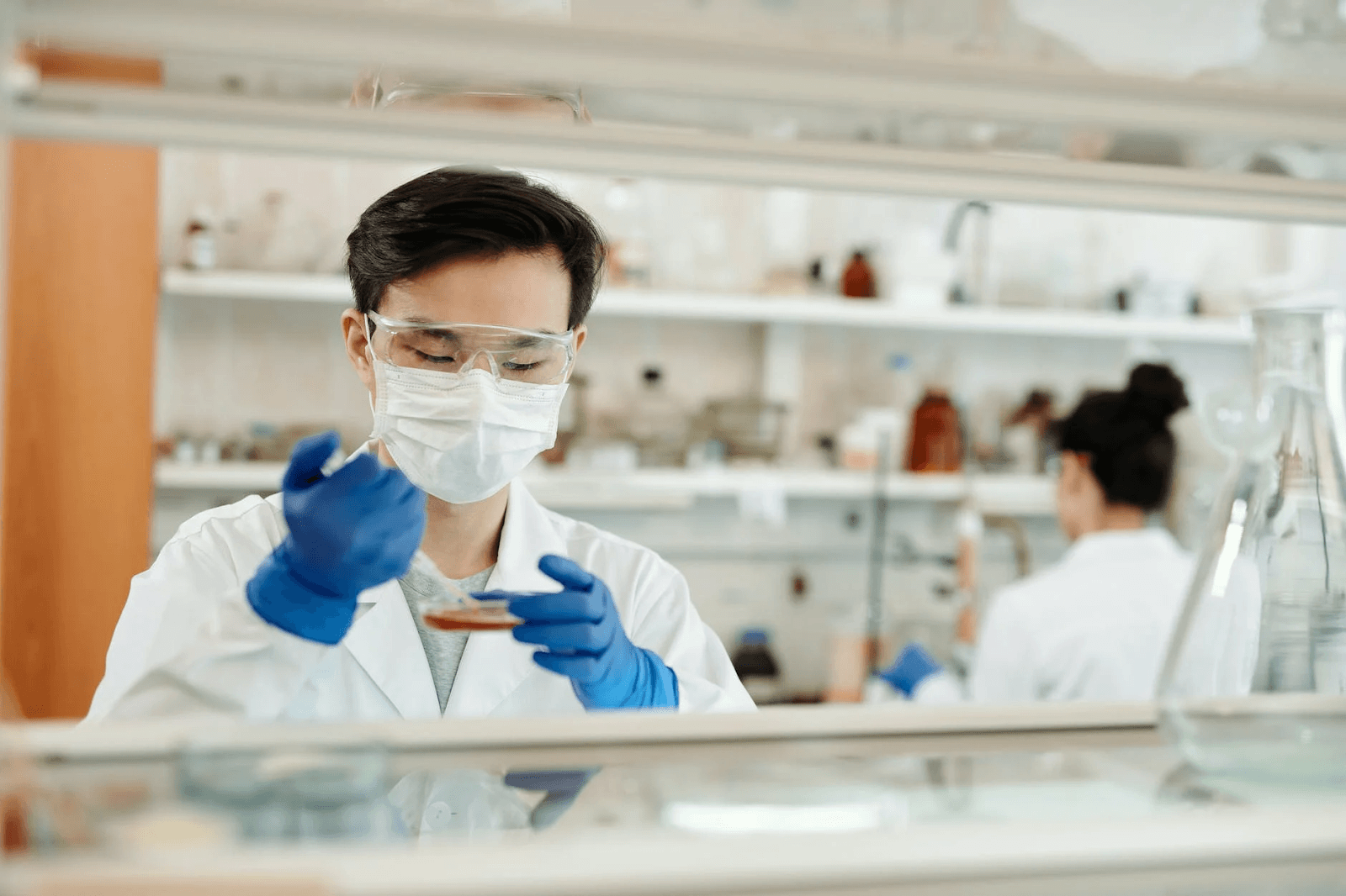 man-doing-a-sample-test-in-the-laboratory key healthcare jobs