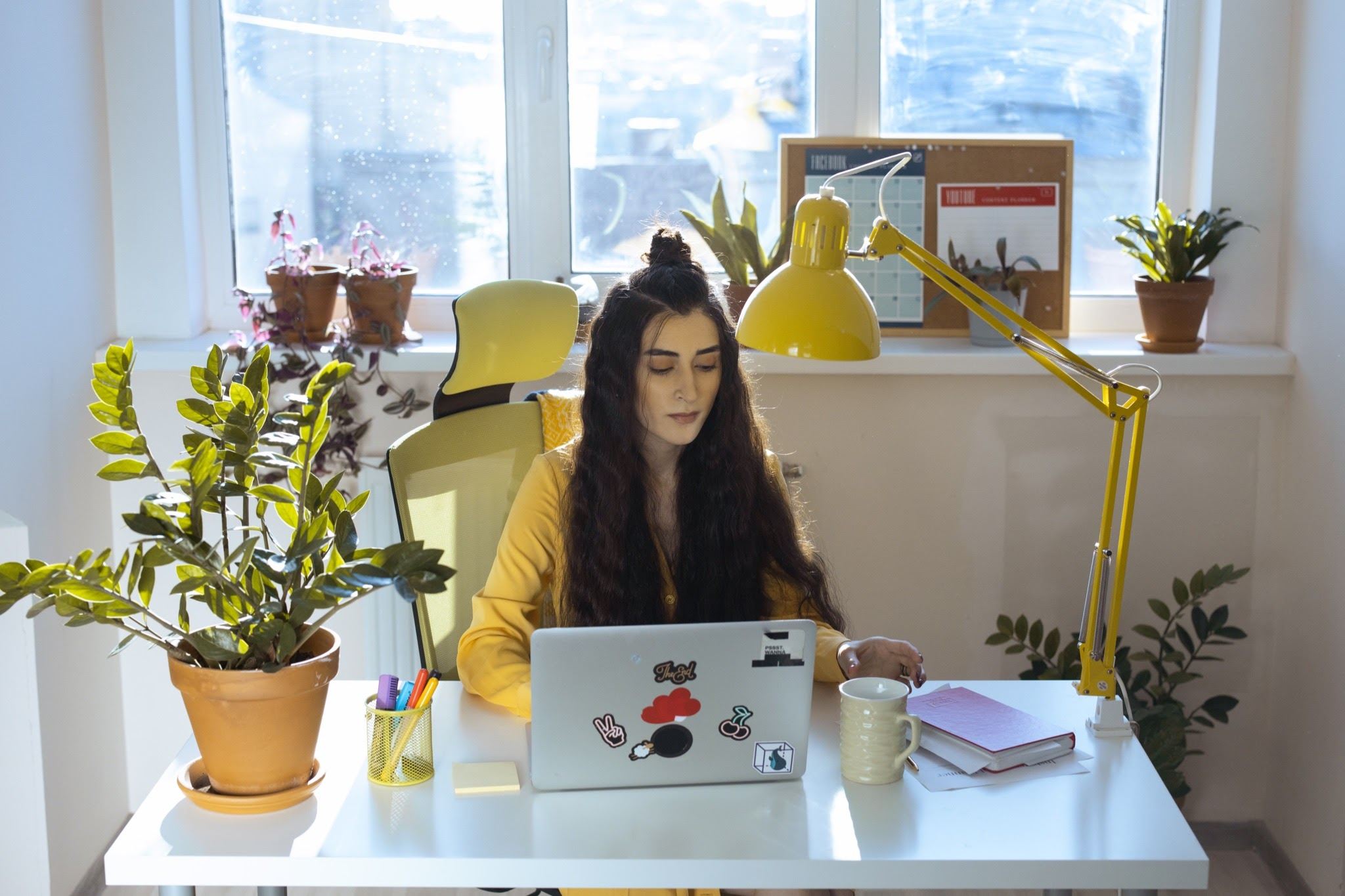 woman working at open laptop Tips For Working From Home
