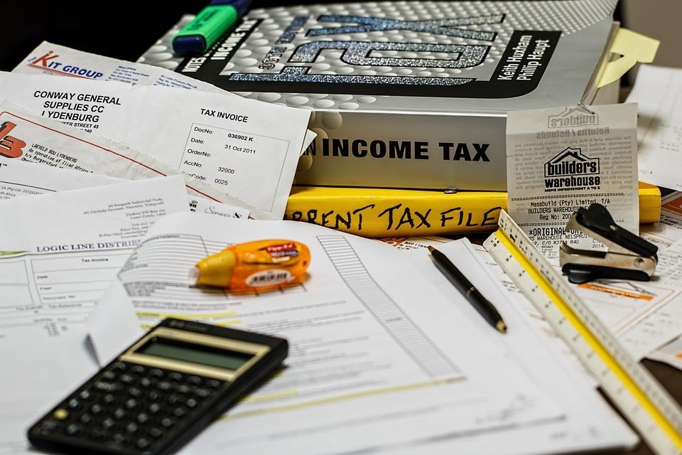 calculator on tax papers and income tax manual