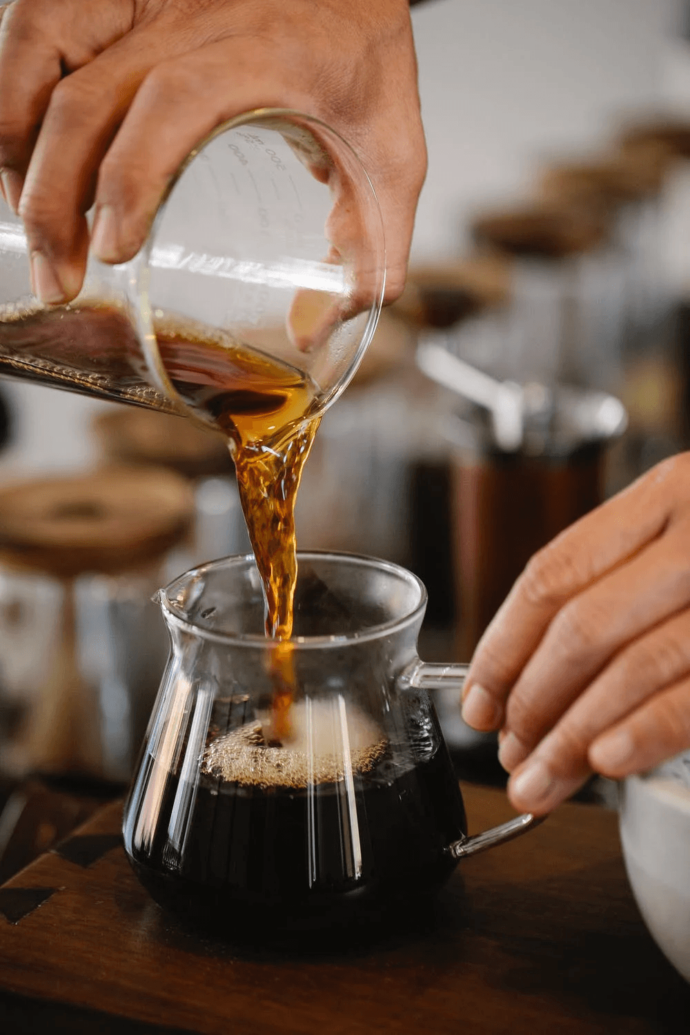 anonymous-man-pouring-fresh-coffee-from-glass-cup-into-pot-ways to increase workplace energy
