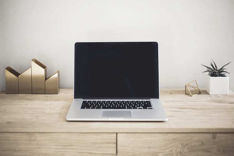open laptop on wooden desk improve your IT skills
