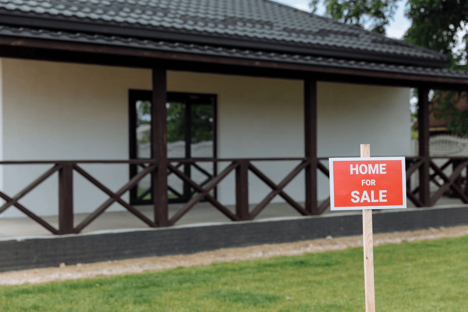 selling your home patio view with home for sale sign