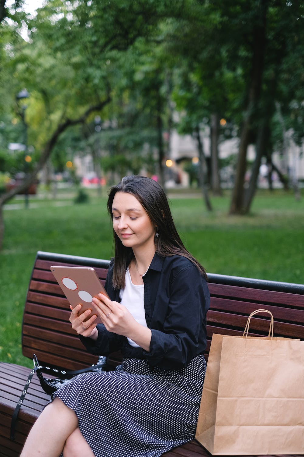 woman-in-black-long-sleeve-shirt-sitting-on-a-bench-using-a-digital-tablet- your online audience