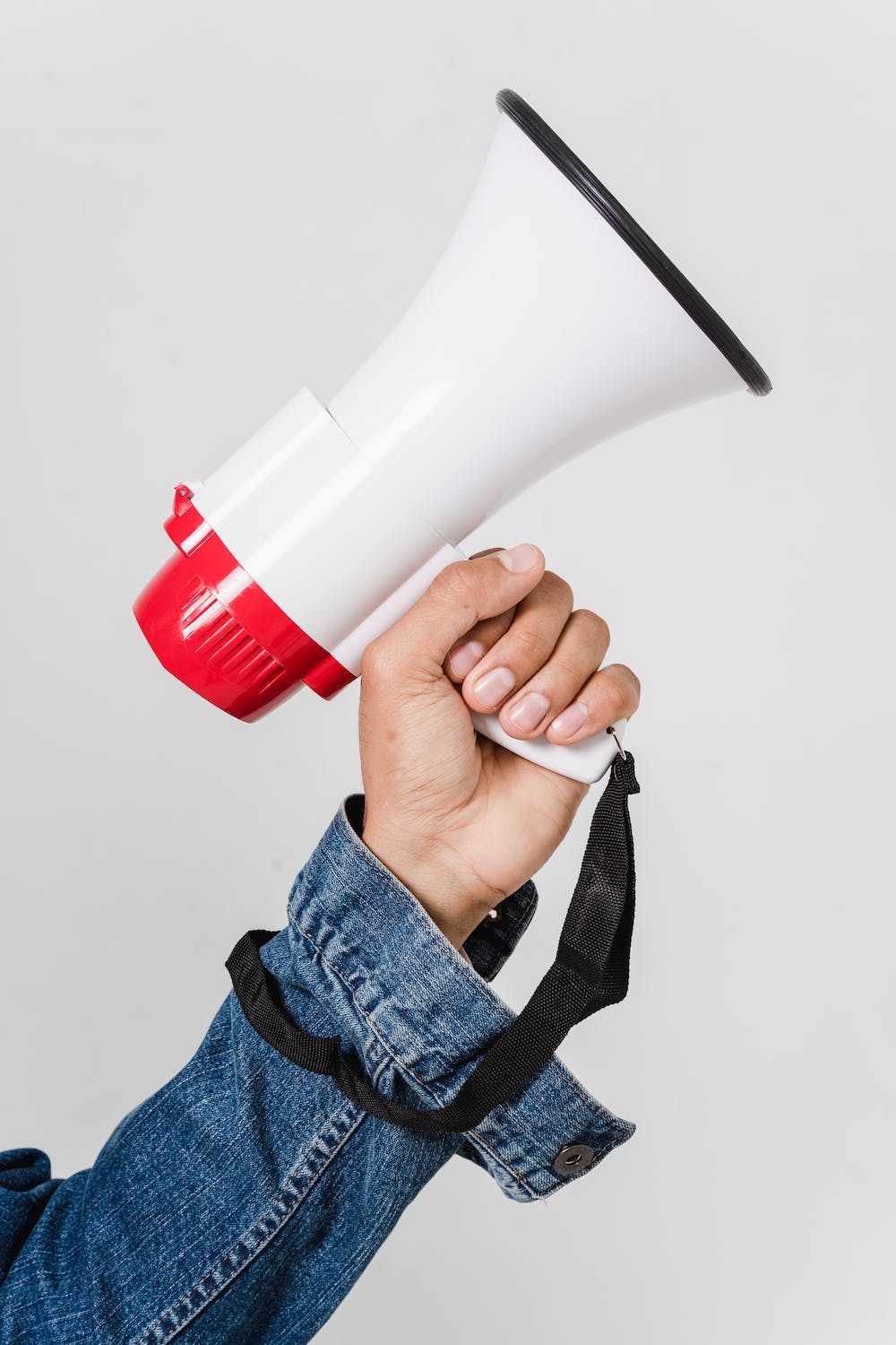 man-in-blue-denim-jacket-holding-a-megaphone-business stands out tips