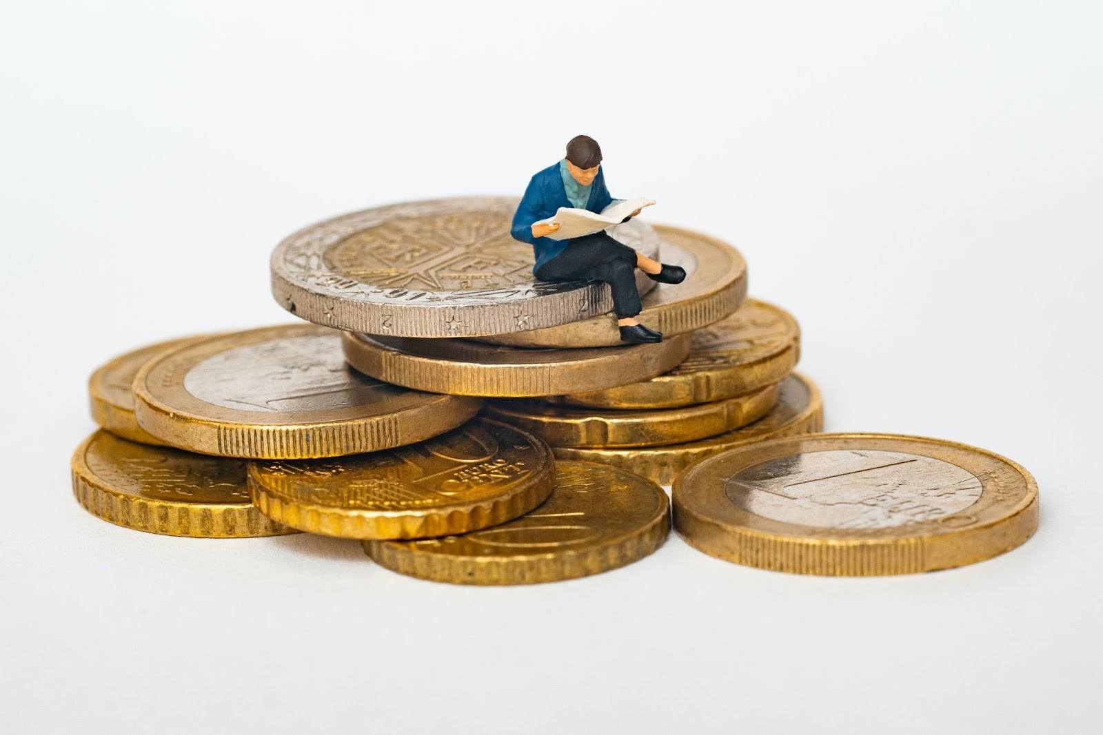 many sitting on a stack of coins financial diversification