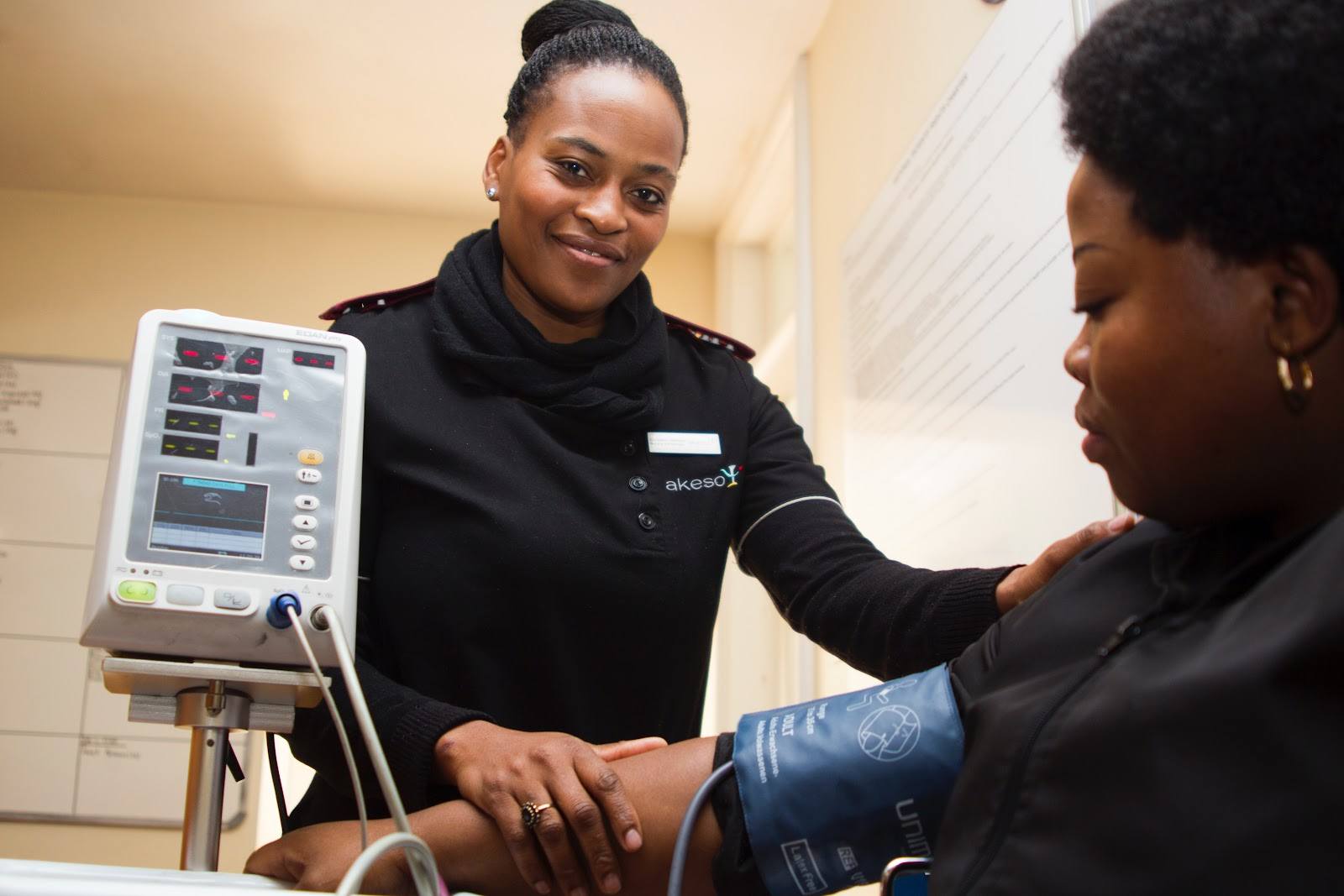female nurse taking blood pressure of woman patient career in healthcare photo credit pA0uoltkwao