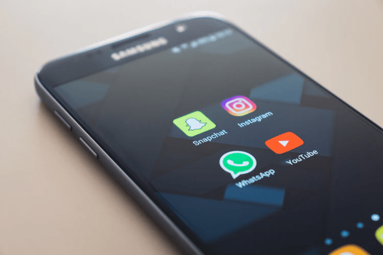 iphone screen with social media icons how to make your business go viral