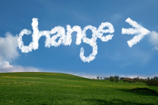the word change written in the sky with airplane smoke